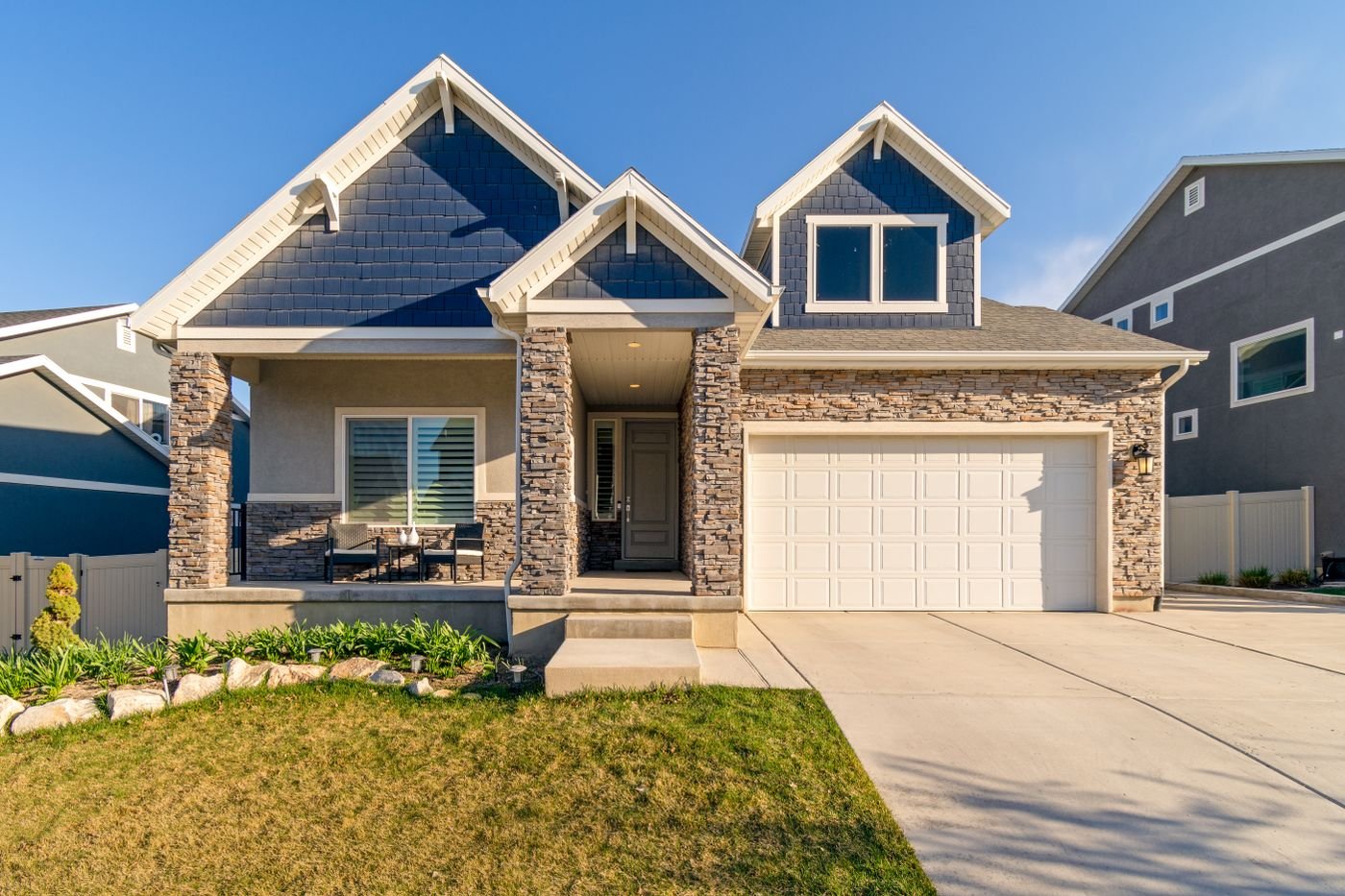 A charming modern suburban home with a stone facade and a neatly maintained lawn. — illustrative residential door hanger delivery photo for Temecula, CA